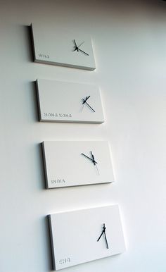 three clocks on the wall with different times