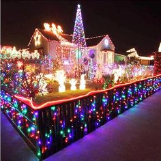 christmas lights on houses and trees in the night