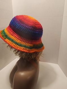 a mannequin's head wearing a multicolored hat