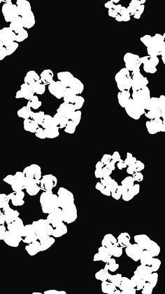 an abstract black and white photo of clouds in the shape of letters o on a black background