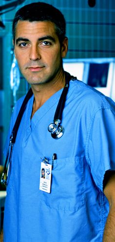 a man in scrubs is posing for the camera