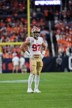 a football player is standing on the field