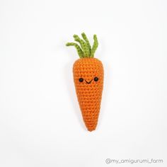 an orange crocheted carrot with eyes on it's head is shown in front of a white background