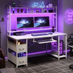 a computer desk with two monitors on top of it and purple lighting in the background