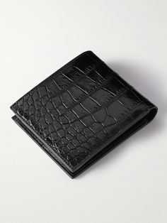 CELINE HOMME's wallet is made from croc-effect leather. It's fitted with eight internal slots, two receipt pockets and bill sleeves. The slender shape slips easily into your pocket or briefcase. Classic Wallet With Crocodile Pattern, Business Bifold Wallets With Crocodile Pattern, Designer Black Wallets With Leather Lining, Luxury Wallets With Crocodile Pattern For Business, Luxury Business Wallets With Crocodile Pattern, Luxury Formal Wallet With Crocodile Pattern, Luxury Crocodile Pattern Wallet For Business, Elegant Crocodile Pattern Formal Wallets, Classic Leather Wallet With Crocodile Pattern