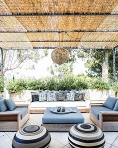 an outdoor living area with blue and white furniture