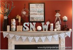 a mantel with snow decorations on it and a sign that says snow above the mantle