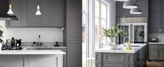 a kitchen with gray cabinets and white counter tops, along with an island in the middle