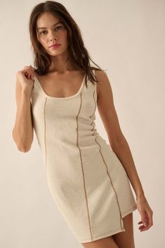 Sew What Exposed-Seam Rib-Knit Tank Mini Dress - ShopPromesa Scooped Neckline, Decorative Stitching, Mini Tank Dress, Knit Mini Dress, Fitted Silhouette, Cream Dress, Asymmetrical Hem, Knit Tanks, Asymmetric Hem