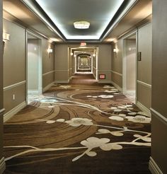 the hallway is clean and ready for guests to use it as a hotel lobby area