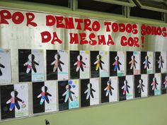 a bulletin board with children's drawings on it in spanish and some other language