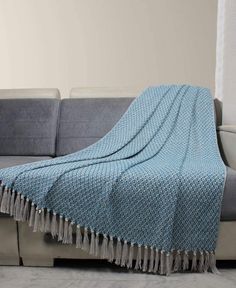 a couch with a blanket on top of it