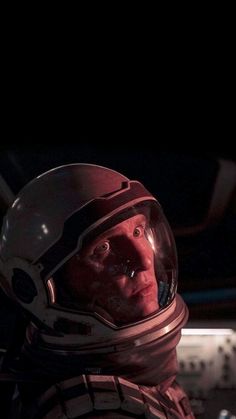 a man in a space suit and helmet