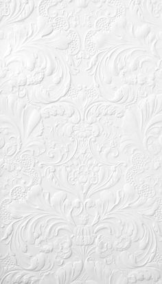 an ornate white wallpaper with intricate designs