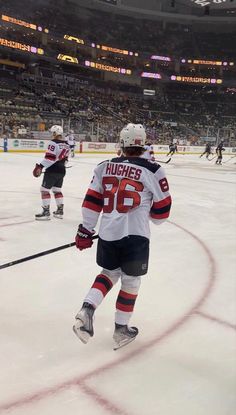 the hockey players are playing on the ice