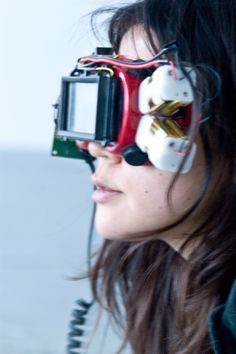 a woman is wearing some kind of goggles