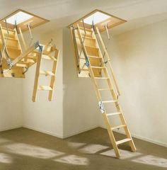 two ladders are suspended from the ceiling in an empty room