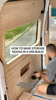 a man is working on the inside of a van that has been built with wood