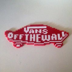 a piece of art made to look like a red bus with the words off the yak on it