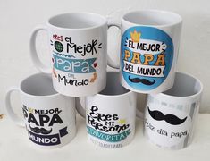 several coffee mugs with different designs on them are stacked in a pyramid together and one has a moustache