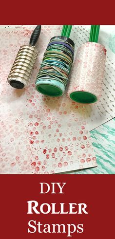 three rolls of rolled up paper sitting next to each other on top of a table