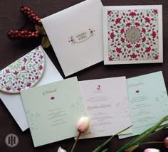 the wedding stationery is laid out on the table