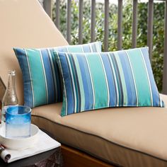 This outdoor pillow set is made with Sunbrella fabric. These pillows are stain and mildew-resistant. Sunbrella Fabric Outdoor, How To Clean Pillows, Patio Pillows, Lounge Cushions, Wicker Sofa, Stripe Throw Pillow, Outdoor Cushions And Pillows, Indoor Outdoor Pillows, Outdoor Chaise