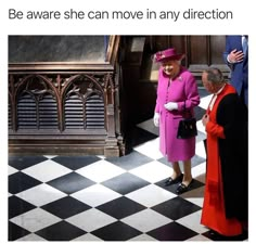 two women in pink dresses and hats standing next to each other on a checkered floor