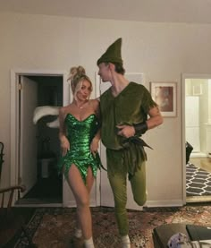 a man and woman dressed up in costumes