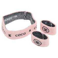 The Chanel Coco CC Logo Knit Headband & Wristband Set in Pink and Black is a chic and stylish accessory duo that effortlessly combines fashion with function. Crafted from a soft and comfortable knit material, the set features a pastel pink base accented with the iconic black CC logo, adding a touch of luxury to any casual ensemble. The headband provides a snug and cozy fit, perfect for keeping hair in place and adding a fashionable statement to your look. The matching wristbands complement the h French Scarf, Vintage Chanel Bag, Striped Shawl, Chanel Suit, Black Louis Vuitton, Chanel Brand, Knit Headband, Logo Knit, Wristband Bracelet