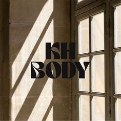 the words ish body are placed in front of an open window on a wall