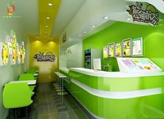 the interior of a fast food restaurant with neon green and white walls, black tile flooring