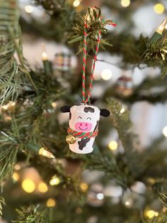 Meet Clarabelle Cow! This adorable Christmas tree ornament is made from recycled champagne corks and hand-painted for your holiday enjoyment. With her jingle bell collar and her love for spreading festive cheer, she’s ready to ring in the holidays with a moo and a twirl! Moooove over, Clarabelle's here!  Clarabelle Cow is a part of the Barnyard Creatures Collection. To purchase more than one creature at a discounted rate, visit our shop! Cork Christmas Tree, Upcycled Wine Corks, Wine Cork Christmas, Clarabelle Cow, Wine Cork Christmas Tree, Cork Christmas, Bell Collar, Cork Christmas Trees, Champagne Corks