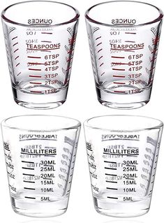 four measuring glasses with measurements on them