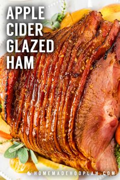 an apple cider glazed ham on a white plate