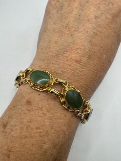 Vintage green jade bracelet 12k gold filled   all hand carved  7.5 inches My jeweler can shorten this for a $20 fee  All jewelry is shipped free in the US in a nice gift box.   Check out our over a THOUSAND great reviews Engraving is $4 per letter and is not always perfect depending on the piece. It can take a few days if the jeweler is busy. This is payable to Paypal Judithsltd@gmail.com Vintage Jade Round Bracelets, Hand-strung Gold Jade Bracelets, Green Jade Bracelet, Hand-strung Turquoise Jade Bracelets, Bohemian Hand-strung Jade Bracelets, Hand-strung Green Jade Bracelets, Jade Bracelet, Green Jade, Bracelet Gold