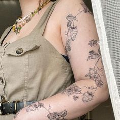 a woman with a tattoo on her arm