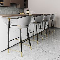 a kitchen with marble counter tops and bar stools