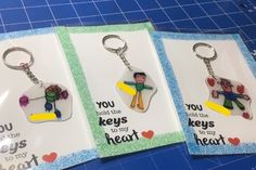 three keychains with pictures of people on them and the words, you hold the keys to my heart