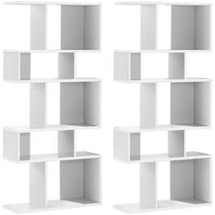 four white bookshelves are stacked on top of each other and one is empty