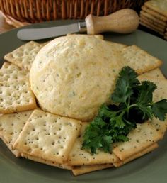 crackers and parsley on a plate with a knife