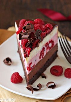 a piece of chocolate raspberry cheesecake on a plate