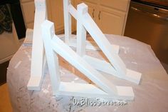 several pieces of white wood sitting on top of a table