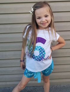 This shirt is perfect for any mermaid themed Birthday. Made with our beautiful no shed glitter its sure to be a hit! We offer design color changes upon request. Please add Child's name into the order notes Shirt: (100% Cotton) Washing Instructions: Turn inside out, wash on a cold cycle, tumble dry low or hang to dry. Don't forget to LIKE us on Facebook! {https://www.facebook.com/Paytonspinkboutique/} Mermaid Party Shirts, Mermaid Mom Shirt Birthday, Mermaid Birthday Family Shirts, Mermaid Bday Shirt, 5th Birthday Shirt Girl Mermaid, Offer Design, Mermaid Shirt, Mermaid Theme Birthday, Girls Clothing Sets