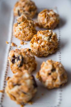 some cookies are sitting on a white plate and ready to be eaten by someone else