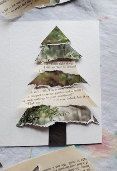 an altered christmas tree made out of torn paper