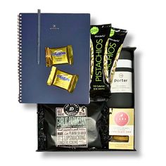 an open notebook with snacks, coffee and other items in it on a white background