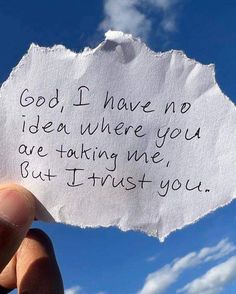 someone holding up a piece of paper that says god, i have no idea where you are taking me but trust you