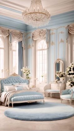 a blue and white bedroom with chandelier, bed, chairs and rugs