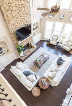 an overhead view of a living room with white furniture